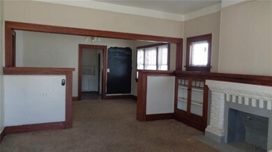 Note vintage wood trim finishes. Dining room has a