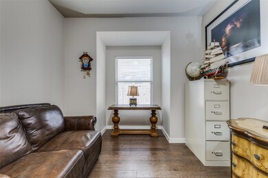 Living area with dark hardwood / wood-style flooring