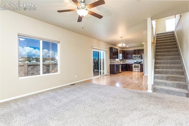 Unfurnished living room with visible vents, basebo