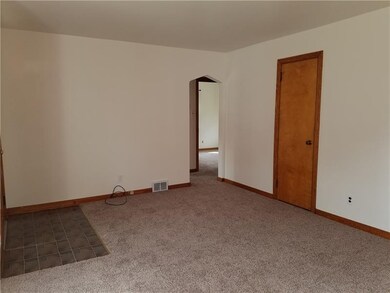 Living room entry way and coat closet.