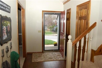 New hardwood floors and light fixture in the entry