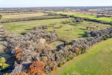 Birds eye view of property featuring a rural view