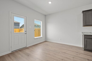Unfurnished dining area featuring light wood-style flooring and recessed lighting