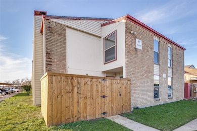 View of side of home featuring a yard