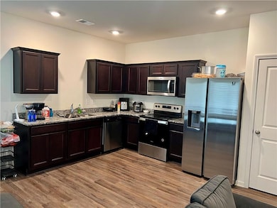 Kitchen featuring appliances with stainless steel 