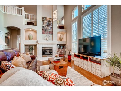 Open Family Room w/wood floor, fireplace
