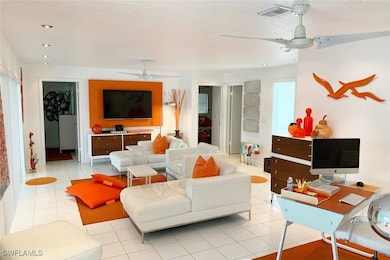 Tiled living area with a ceiling fan