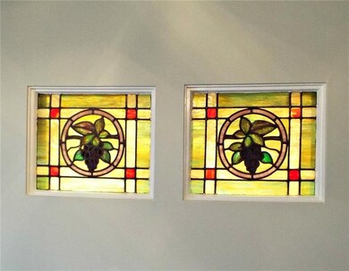 Two stained glass windows in dining room