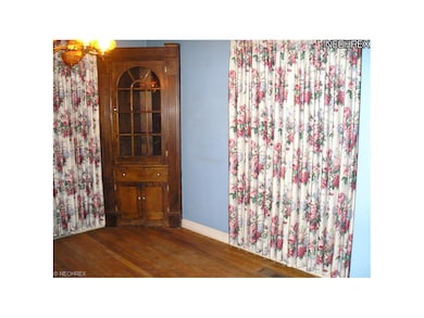 Formal Dining Room with Hardwood Floors and    Two Corner Cabinets