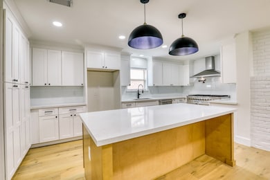 Completely reimagined kitchen with all new cabinetry and appliances.
