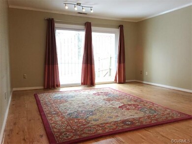 Newer laminate, wood flooring, track lighting and 