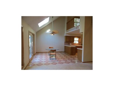 Large casual dining, new sky-light, doors to deck.