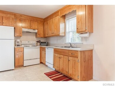Fully equipped kitchen with honey oak cabinets.