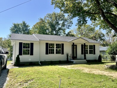 Another view of the house.   There is landscaping but it is hard to see in this picture.  It has a Gorgeous Tree in the front yard.