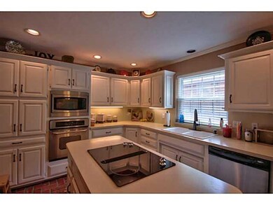 Kitchen. Stainless steel appliances and paver floo