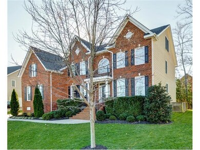 Beautifully landscaped yard with natural wooded ar