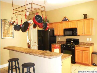 The kitchen is open to the living room and breakfa