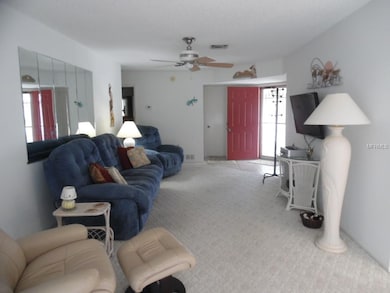 Front door opens to tiled entryway and the Living 