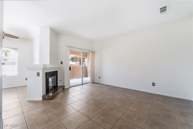 Unfurnished living room with tile patterned floori