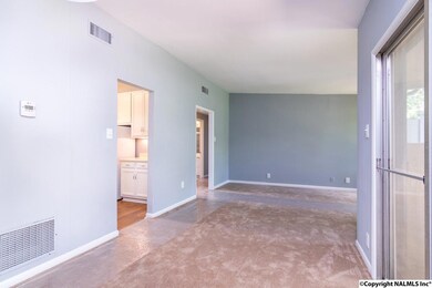 The dining room features a slider which opens to the privacy fenced back patio.  The patio extends the living area and is a great spot to grill and chill.
