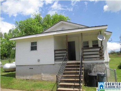 Back of home showing covered back porch.