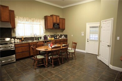 Large eat-in kitchen has stainless steel appliance
