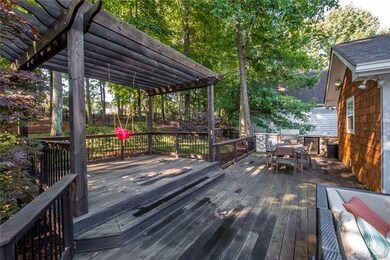 Rear deck with pergola and outdoor kitchen.