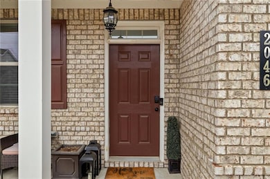 Entrance to property featuring covered porch and b