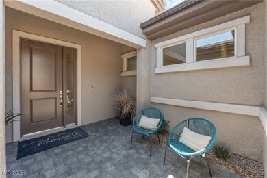 View of exterior entry with stucco siding