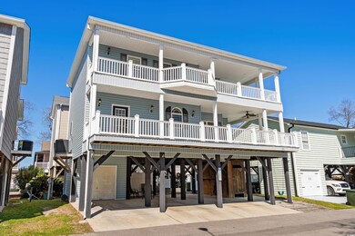 Coastal inspired home with a carport, driveway, a 