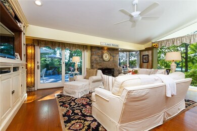 Living room  with Harmon pellet stove. 8'tall glas