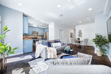 Living area with baseboards and recessed lighting
