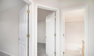 Hall featuring baseboards