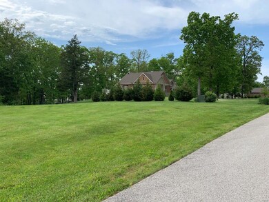 Blacktop frontage with nice homes in the area
