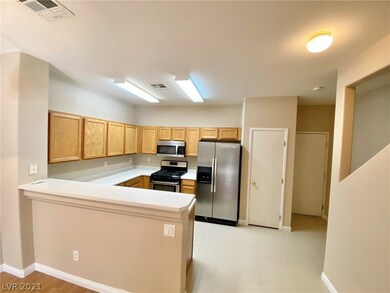 Kitchen with breakfast bar, stainless appliances a
