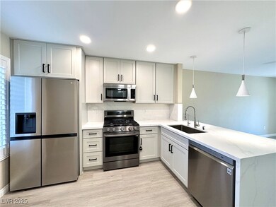 Kitchen featuring stainless steel appliances, a pe