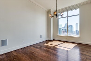 Spare room featuring a chandelier, dark hardwood /