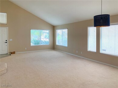 Unfurnished living room with light colored carpet,