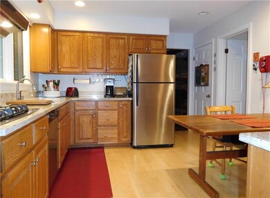 Kitchen has access to dining room, front hall and 