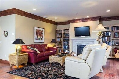 Double crown moulding and recessed lighting grace 
