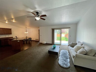 Living room open to kitchen and dining