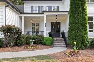 View of exterior entry with a porch