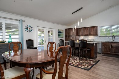 The dining area with fireplace off the kitchen can