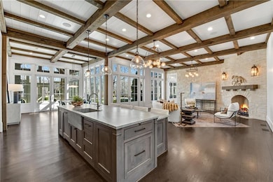 Kitchen featuring dark wood finished floors, open 