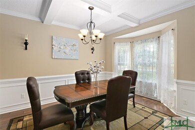 FORMAL DINING ROOM WITH EXTENSIVE MOLDING, BAY WIN
