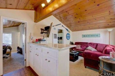 Back unit kitchen opens to family room. 