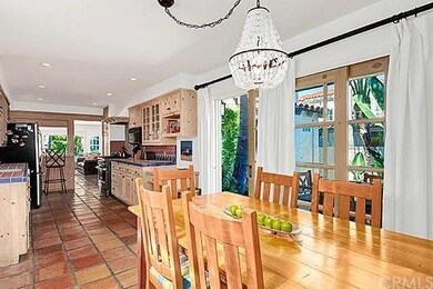 Kitchen and eating area exudes charm and opens to 