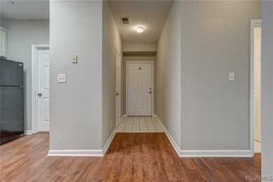 Note Tile entry and engineered, laminate wood floo