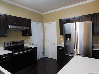 Kitchen view pantry & garage doors
