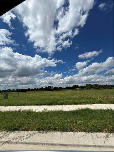 View of yard with a rural view